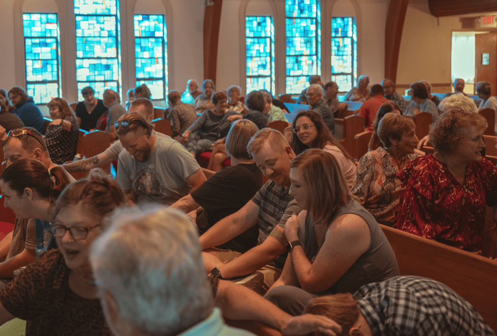 Compass Church folks build community in worship.